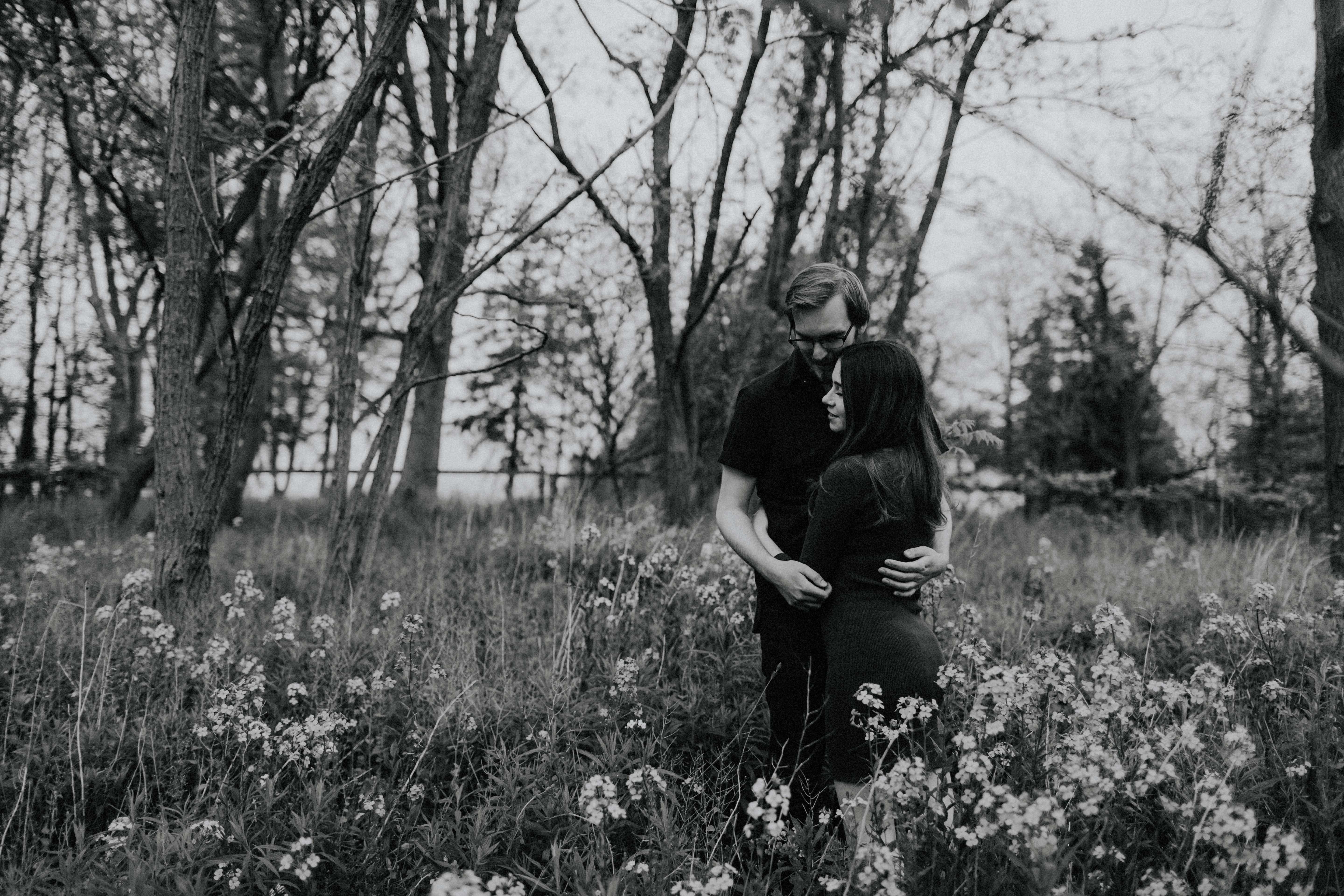 couple embrace in wildflowers