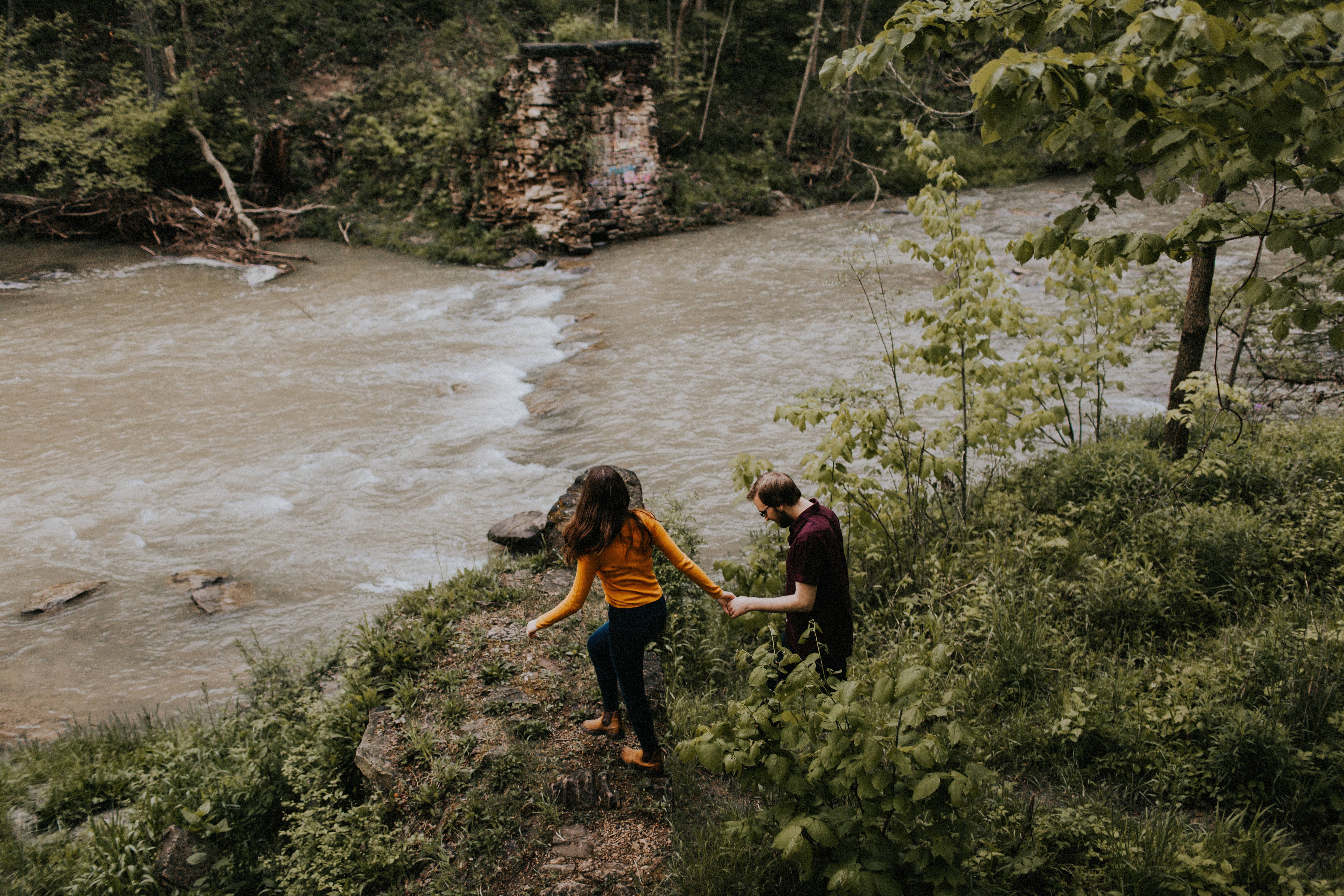 couple walking by stream