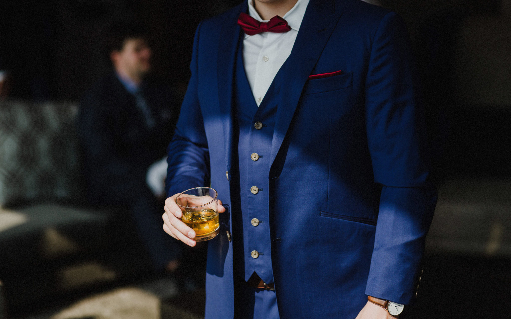 groom holds scotch