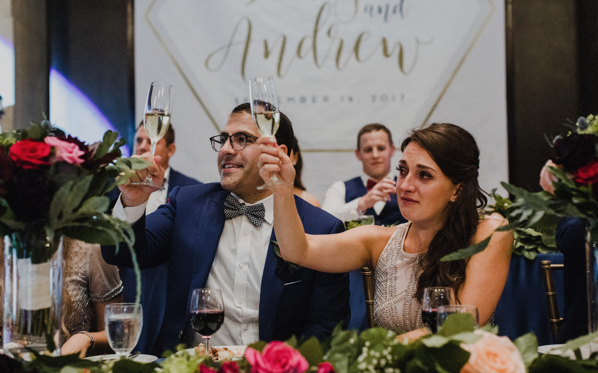 bridal party toasts at reception