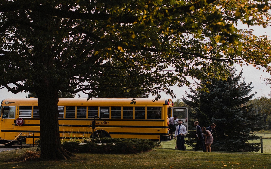 wedding guests arrive by bus