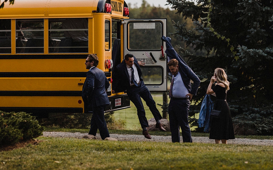 wedding guests hop out of bus