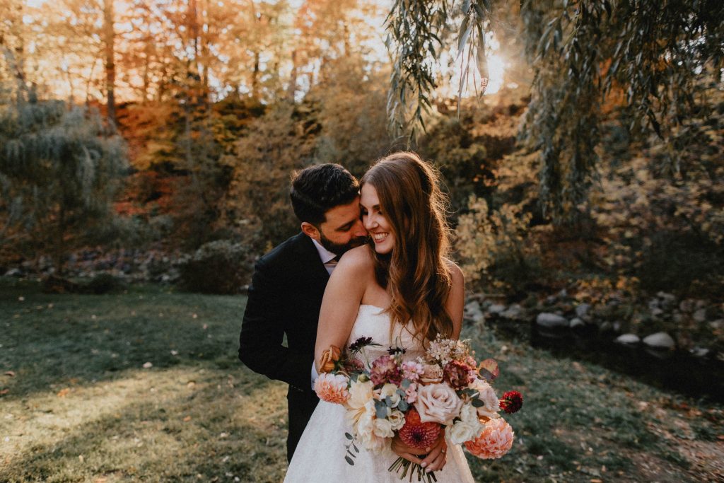 Autumn Micro Wedding at Berkeley Field House - Bride and Groom Embrace in Park