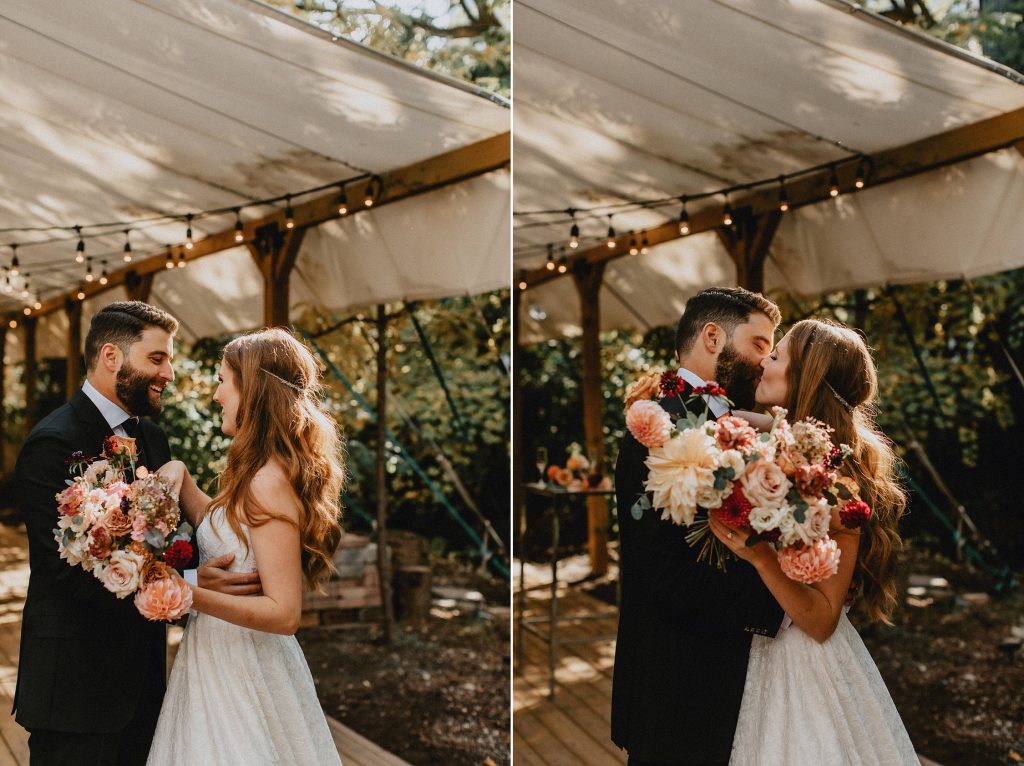Bride and groom kiss on patio under string-lights - Autumn Micro Wedding at Berkeley Fieldhouse
