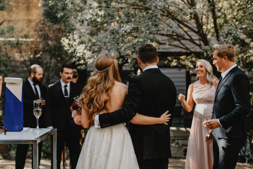 Bride and groom embrace during reception - Autumn Micro Wedding at Berkeley Fieldhouse