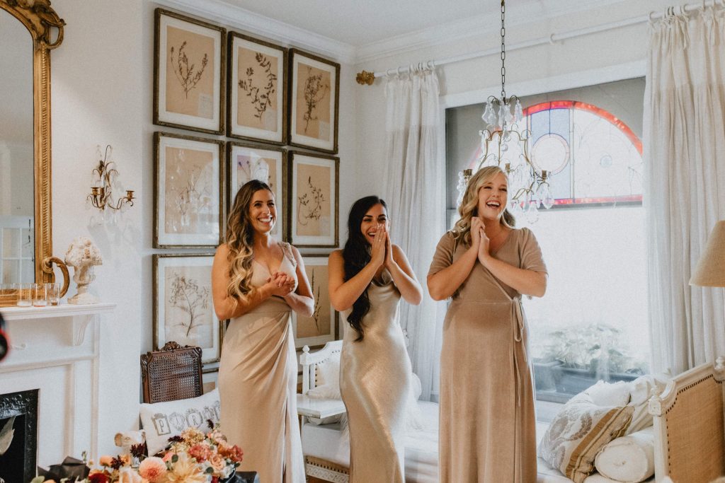 First look reaction from bridesmaids - Autumn Micro Wedding at Berkeley Fieldhouse