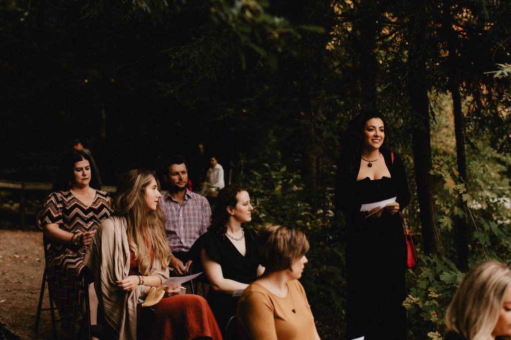 Guests read poetry during forest wedding ceremony - Huron Natural Area Micro Wedding Kitchener, Ontario
