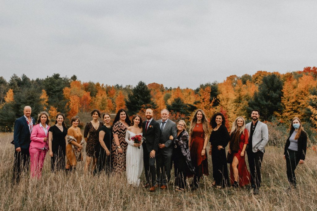 Friends and family pose in the field - Huron Natural Area Micro Wedding Kitchener, Ontario